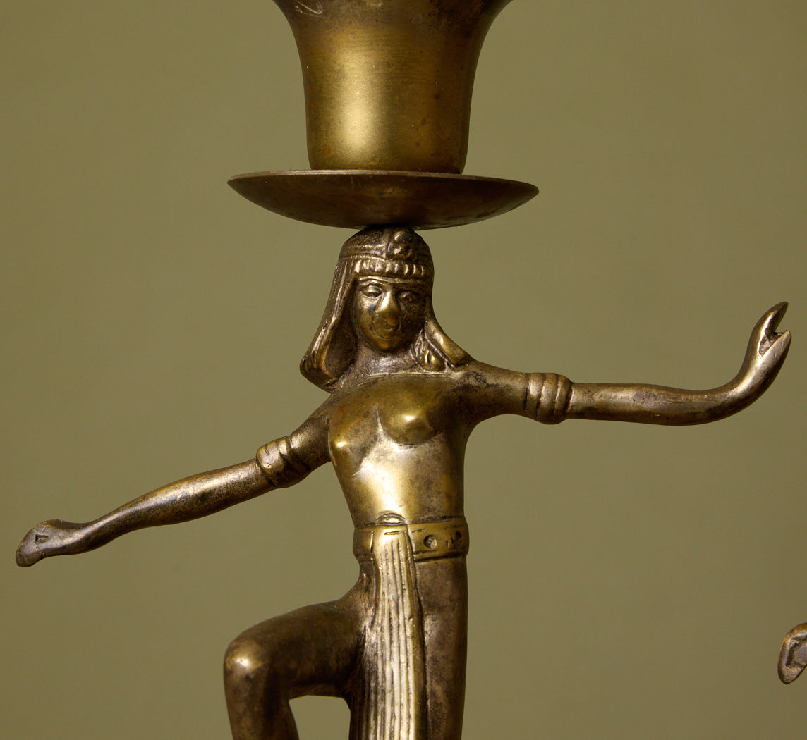 PAIR OF 1920S DANCING EGYPTIAN FIGURE CANDLESTICK HOLDERS