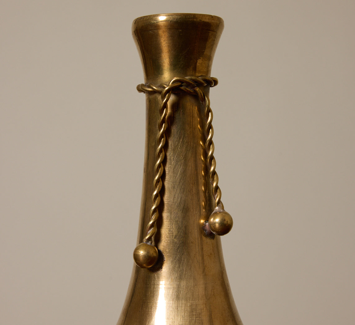 PAIR OF ASYMMETRICAL BRASS TASSEL CANDLESTICK HOLDERS