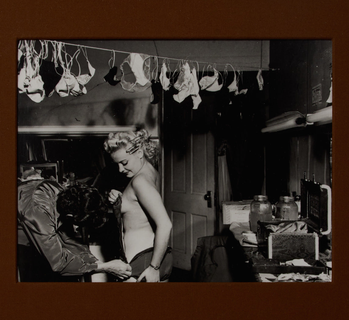 1950S SHOWGIRL CHANGING IN DRESSING ROOM BY WEEGEE