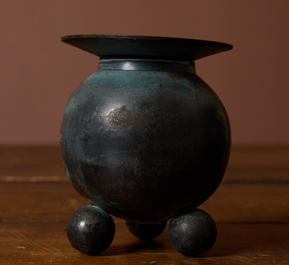 PAIR OF VINTAGE PATINATED FOOTED ORB CANDLESTICK HOLDERS