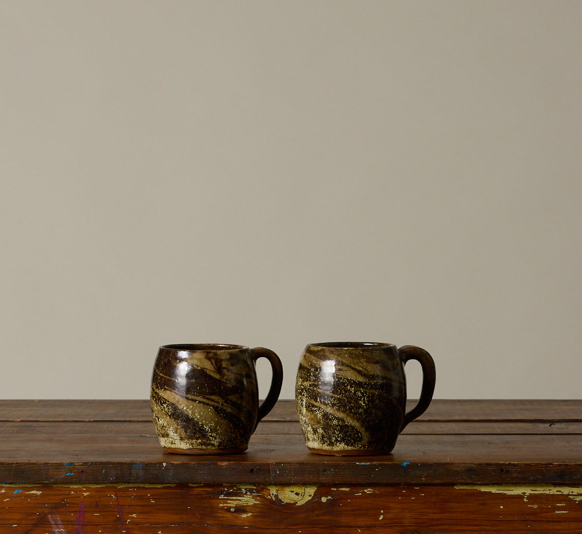 PAIR OF EARTHENWARE SWIRL MUGS