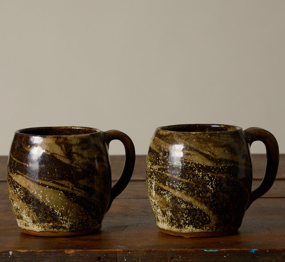 PAIR OF EARTHENWARE SWIRL MUGS