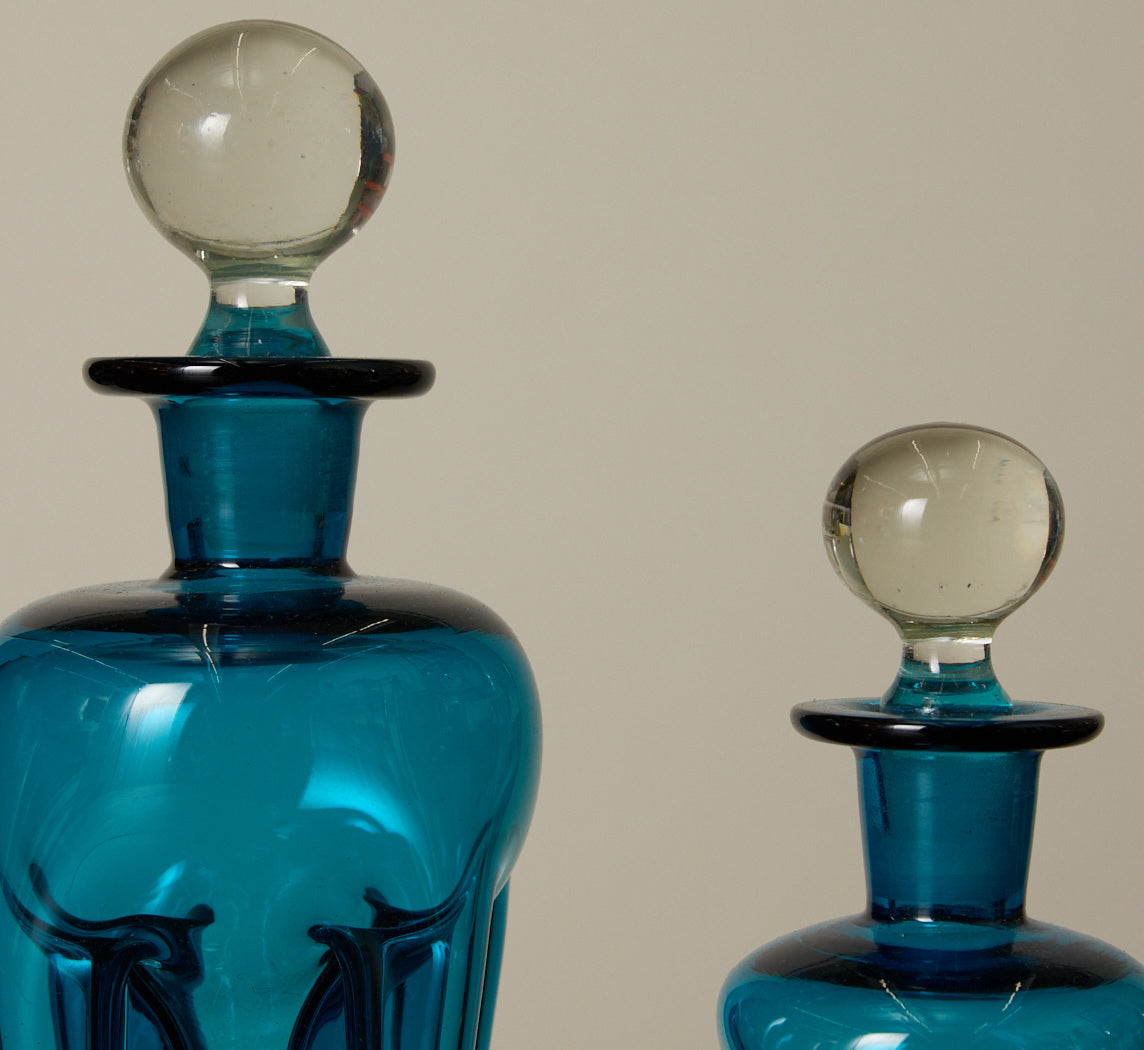 PAIR OF MID CENTURY BLUE GLASS DECANTERS
