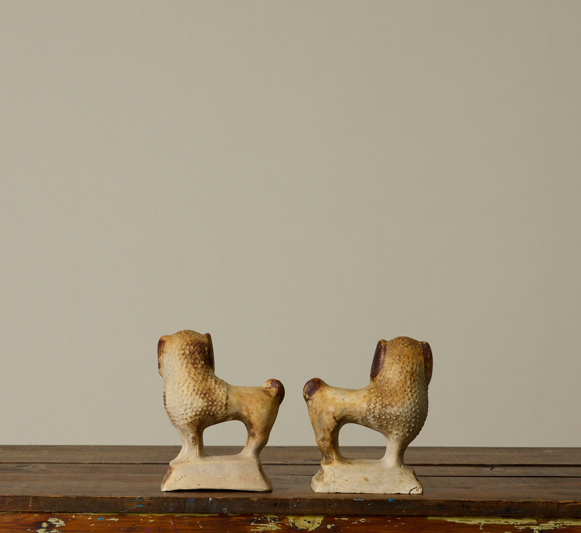 PAIR OF 19TH CENTURY AMERICAN CHALKWARE POODLE FIGURINES