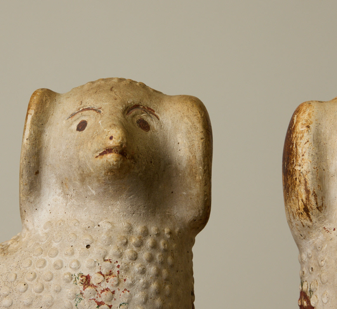PAIR OF 19TH CENTURY AMERICAN CHALKWARE POODLE FIGURINES