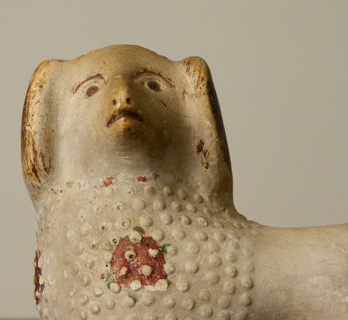 PAIR OF 19TH CENTURY AMERICAN CHALKWARE POODLE FIGURINES