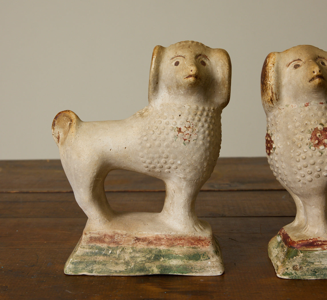 PAIR OF 19TH CENTURY AMERICAN CHALKWARE POODLE FIGURINES