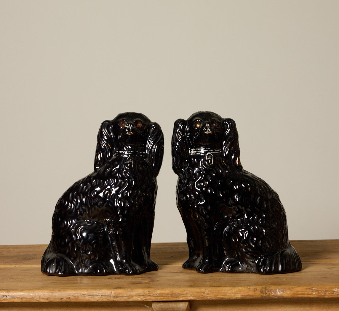 PAIR OF BLACK STAFFORDSHIRE SPANIEL FIGURES