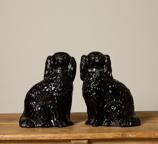 PAIR OF BLACK STAFFORDSHIRE SPANIEL FIGURES