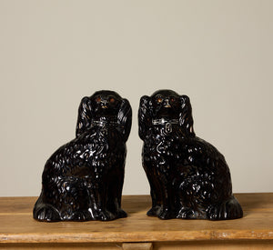 PAIR OF BLACK STAFFORDSHIRE SPANIEL FIGURES