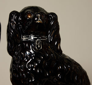 PAIR OF BLACK STAFFORDSHIRE SPANIEL FIGURES