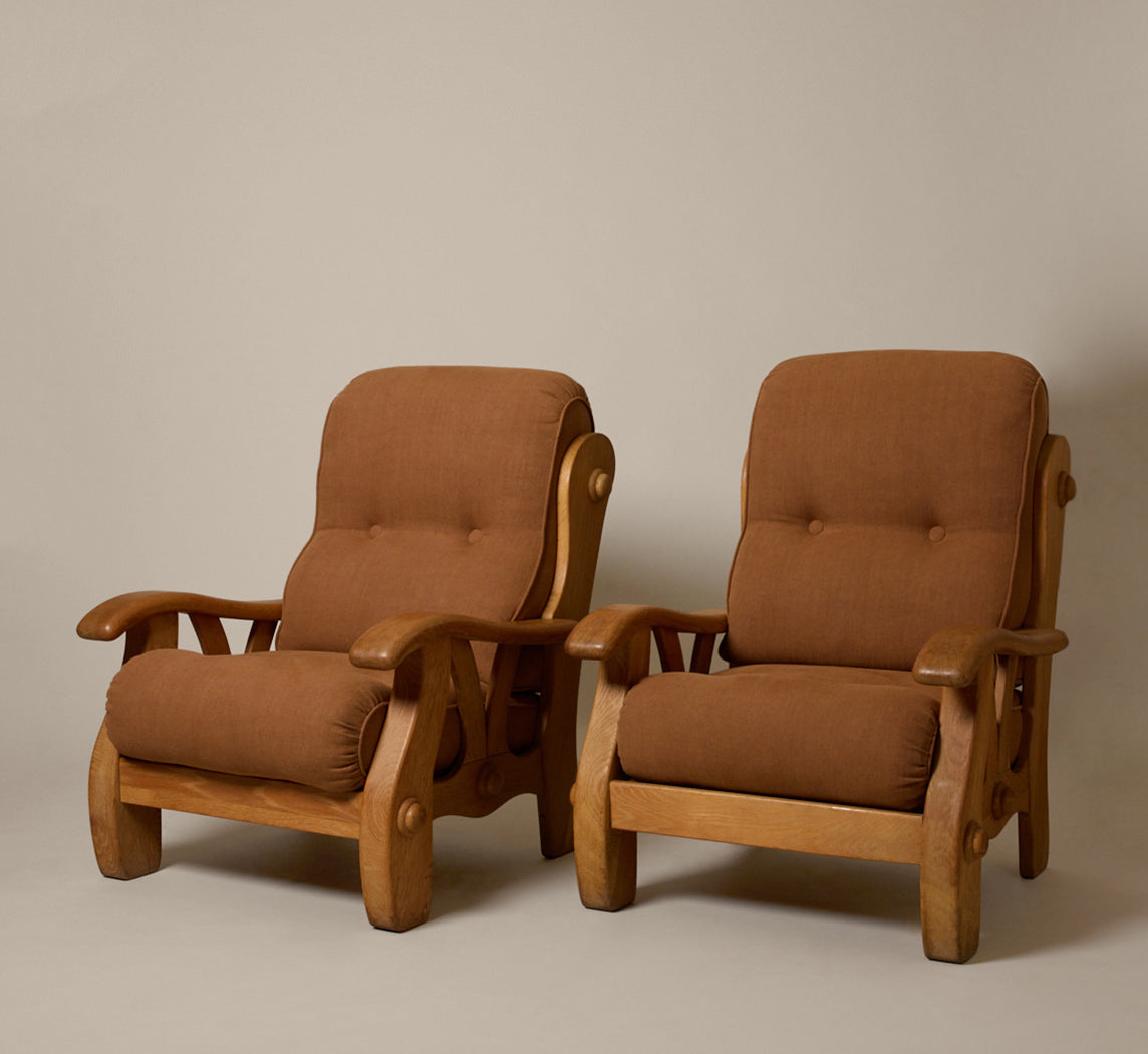 PAIR OF 1960S SCULPTURAL HEAVY OAK LOUNGE CHAIRS WITH MOKUM COPPER LINEN CUSHIONS