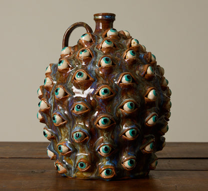 20TH CENTURY FOLK ART POTTERY EYEBALL JUG