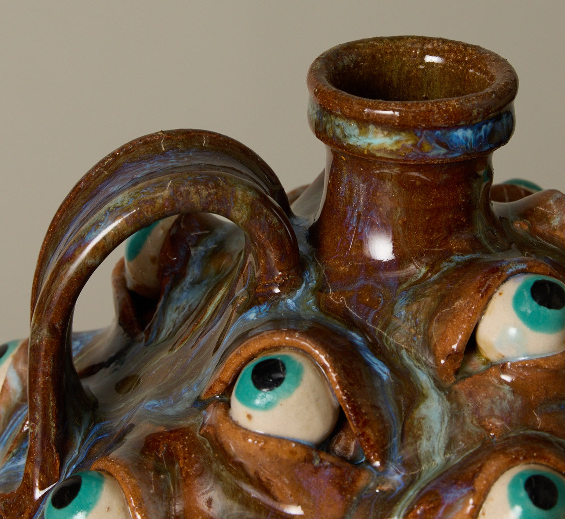 20TH CENTURY FOLK ART POTTERY EYEBALL JUG