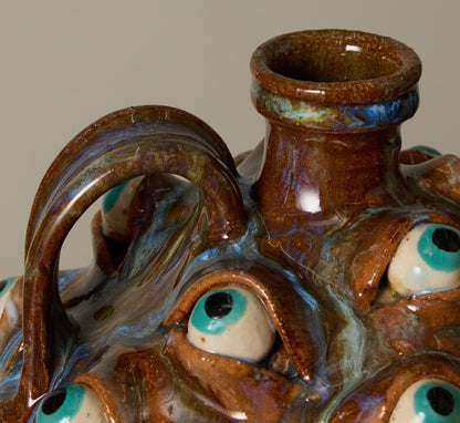 20TH CENTURY FOLK ART POTTERY EYEBALL JUG