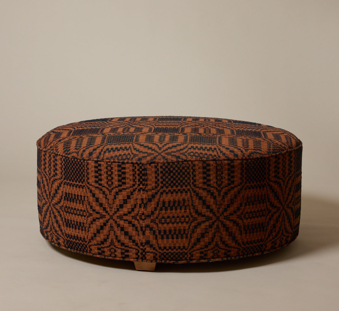 PIERCE & WARD CIRCLE OTTOMAN IN AMERICAN COVERLET