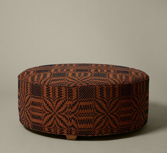 PIERCE & WARD CIRCLE OTTOMAN IN AMERICAN COVERLET