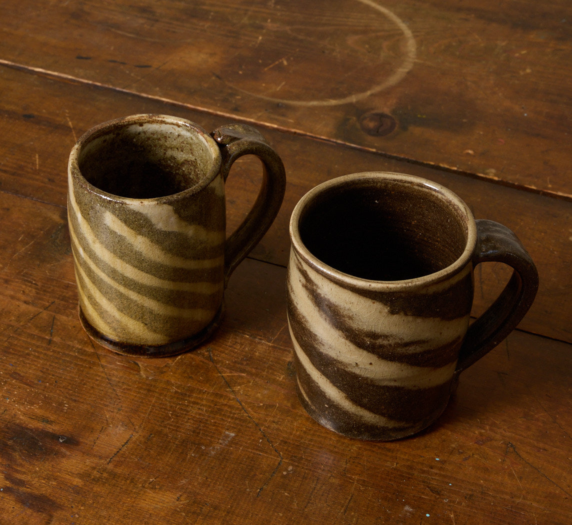 PAIR OF VINTAGE EARTHENWARE SWIRL MUGS