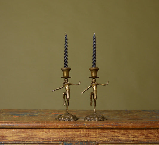 PAIR OF 1920S DANCING EGYPTIAN FIGURE CANDLESTICK HOLDERS