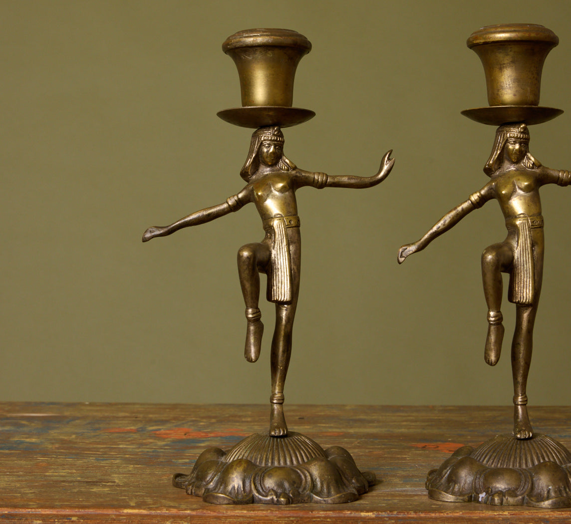 PAIR OF 1920S DANCING EGYPTIAN FIGURE CANDLESTICK HOLDERS