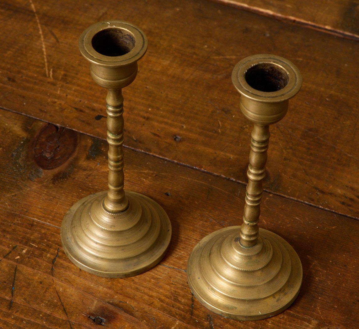 PAIR OF ANTIQUE BRASS RIBBED CANDLESTICK HOLDERS