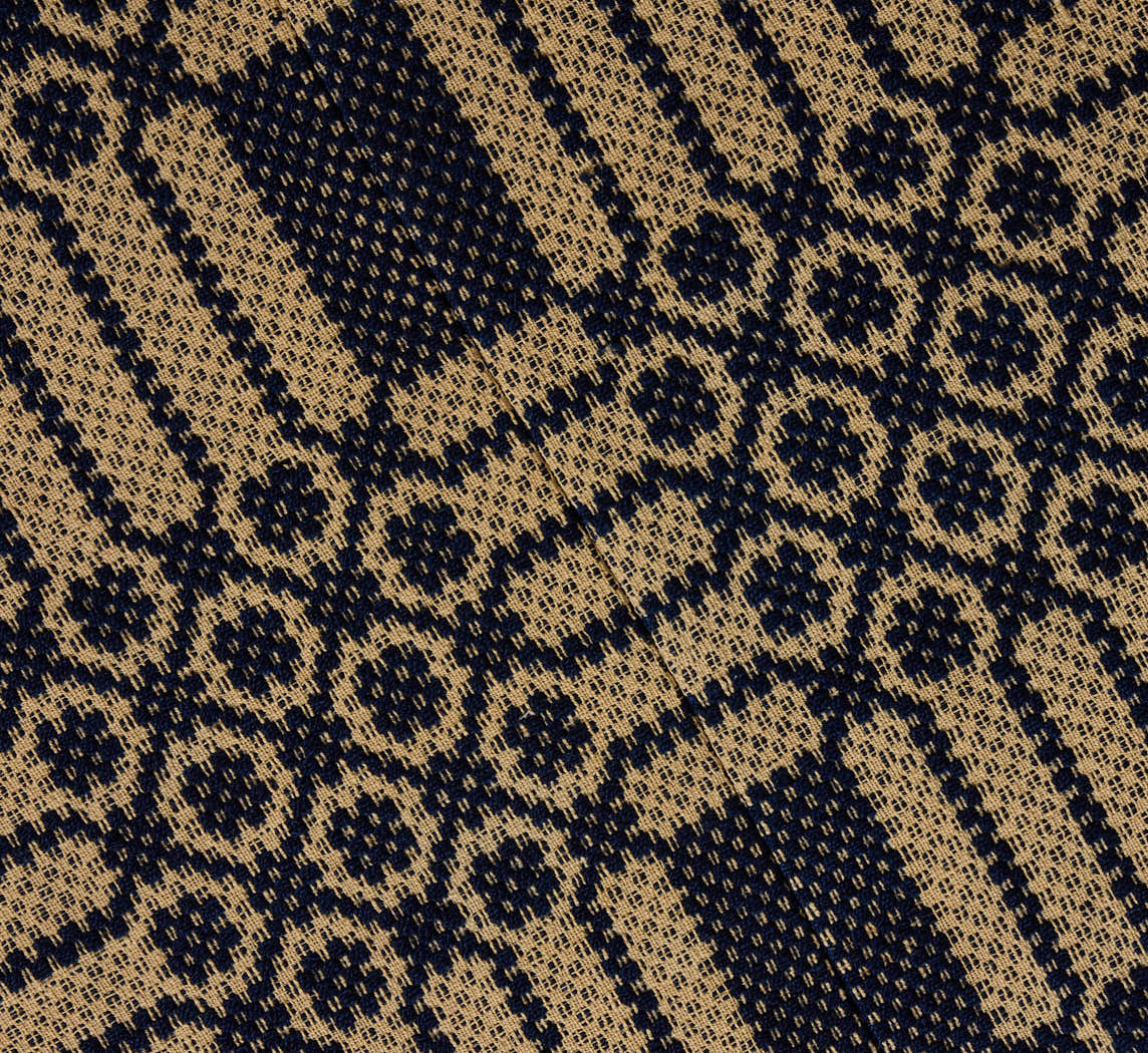 PIERCE & WARD CIRCLE OTTOMAN IN ANTIQUE AMERICAN COVERLET