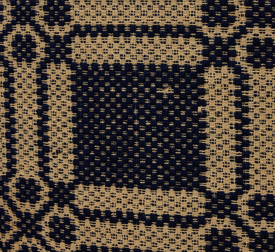 PIERCE & WARD CIRCLE OTTOMAN IN ANTIQUE AMERICAN COVERLET