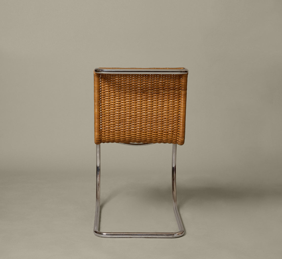 SET OF 8 CANE & CHROME CANTILEVER CHAIRS ATTR. TO MIES VAN DER ROHE