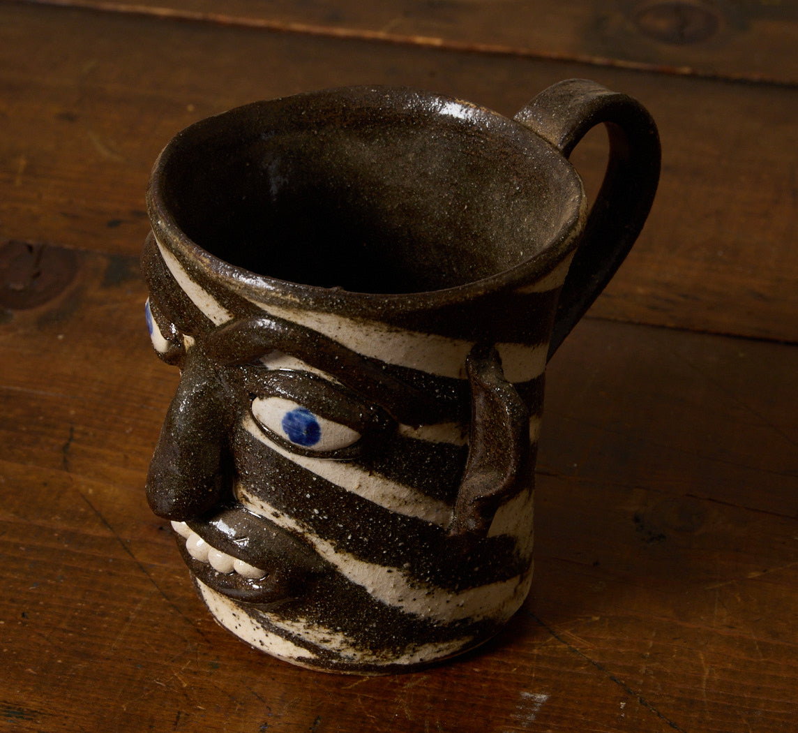 AMERICAN FOLK ART EARTHENWARE SWIRL FACE MUG