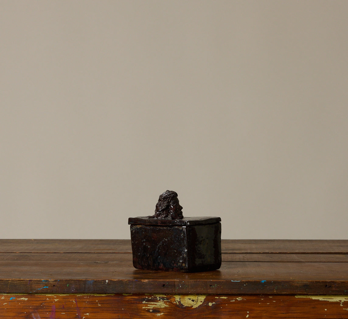 BLACK CERAMIC FIGURE BOX WITH BUST