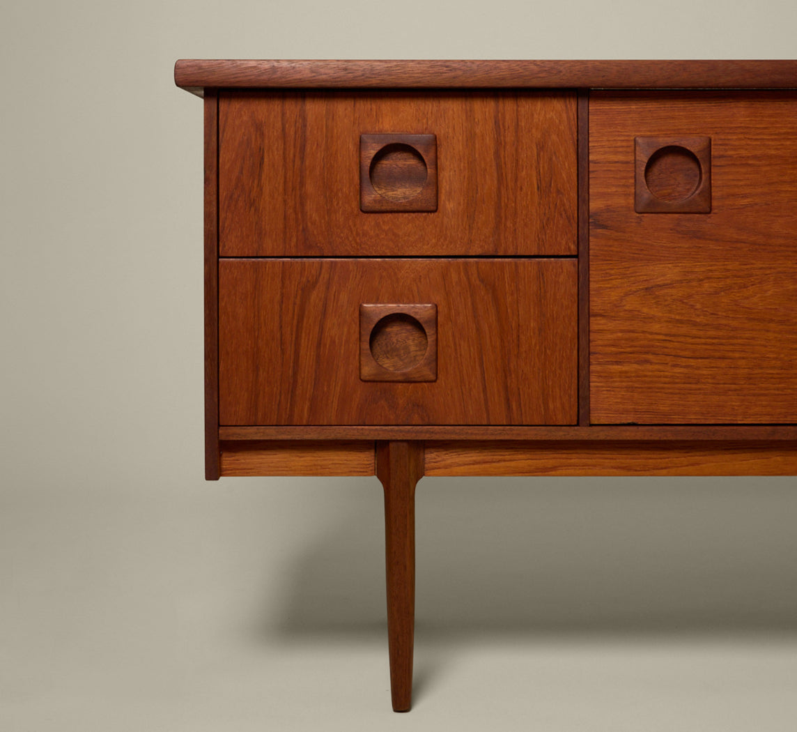 MIDCENTURY ENGLISH TEAK SLIDING DOOR SIDEBOARD