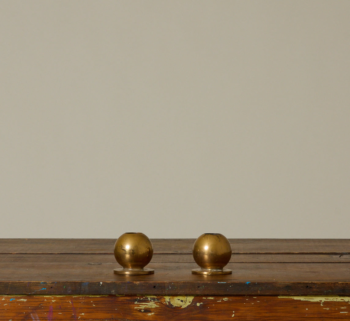 PAIR OF HEAVY DANISH MIDCENTURY BRASS ORB CANDLESTICK HOLDERS