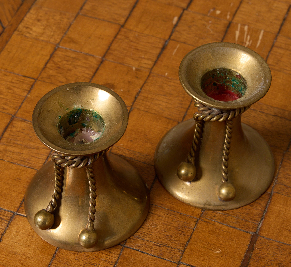 PAIR OF VINTAGE BRASS CANDLESTICKS WITH ROPE TASSELS