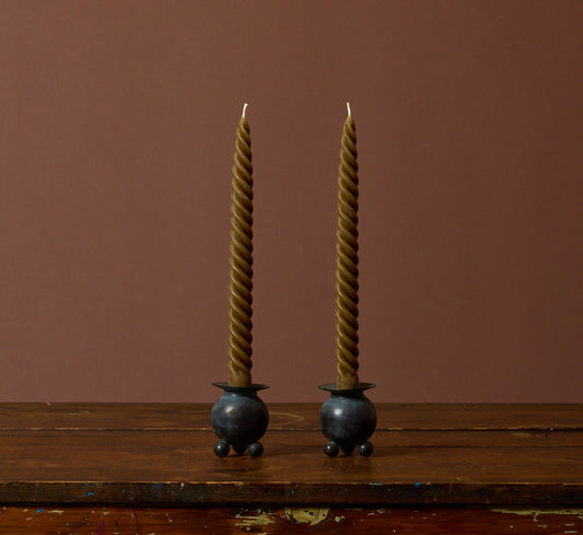 PAIR OF VINTAGE PATINATED FOOTED ORB CANDLESTICK HOLDERS