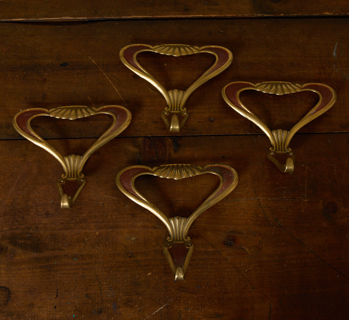 SET OF 4 1920S ITALIAN BRASS AND ENAMEL HOOKS