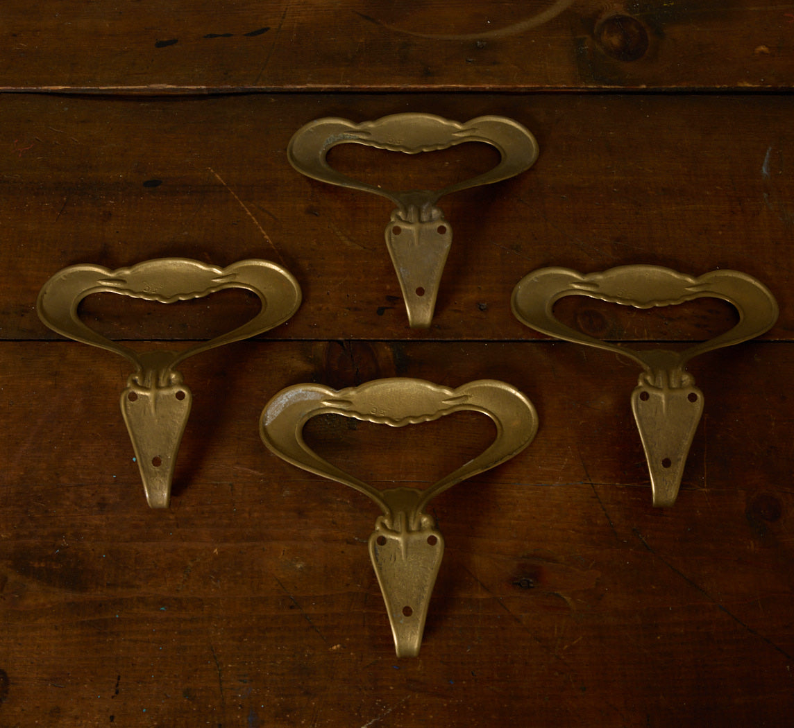 SET OF 4 1920S ITALIAN BRASS AND ENAMEL HOOKS