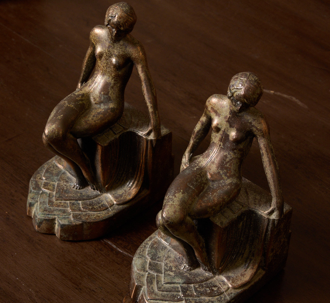 PAIR OF 1920S ART DECO SPELTER SEATED NUDE BOOKENDS
