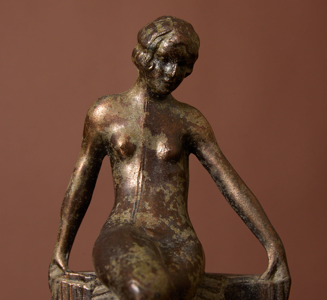 PAIR OF 1920S ART DECO SPELTER SEATED NUDE BOOKENDS