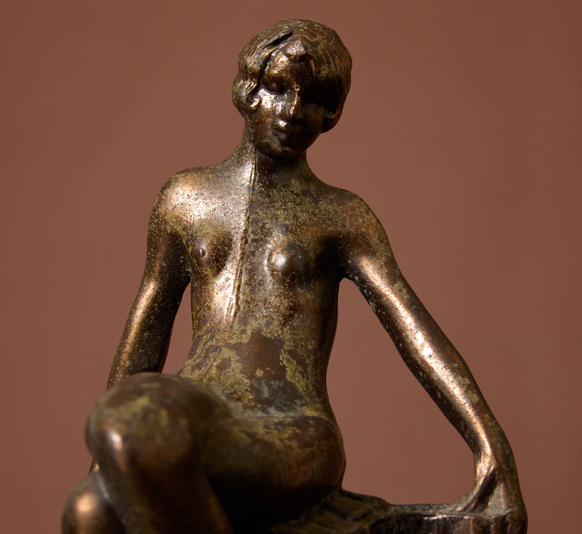 PAIR OF 1920S ART DECO SPELTER SEATED NUDE BOOKENDS