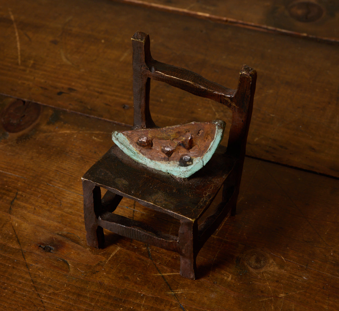 BRONZE SCULPTURE STUDY OF WATERMELON ON CHAIR