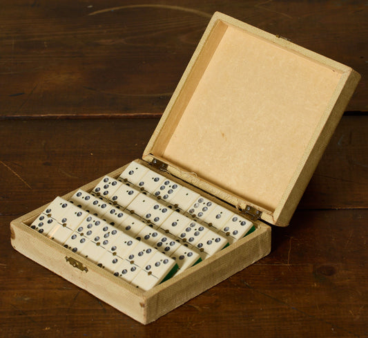 1930S BAKELITE DOMINOES SET WITH BRASS TIPS