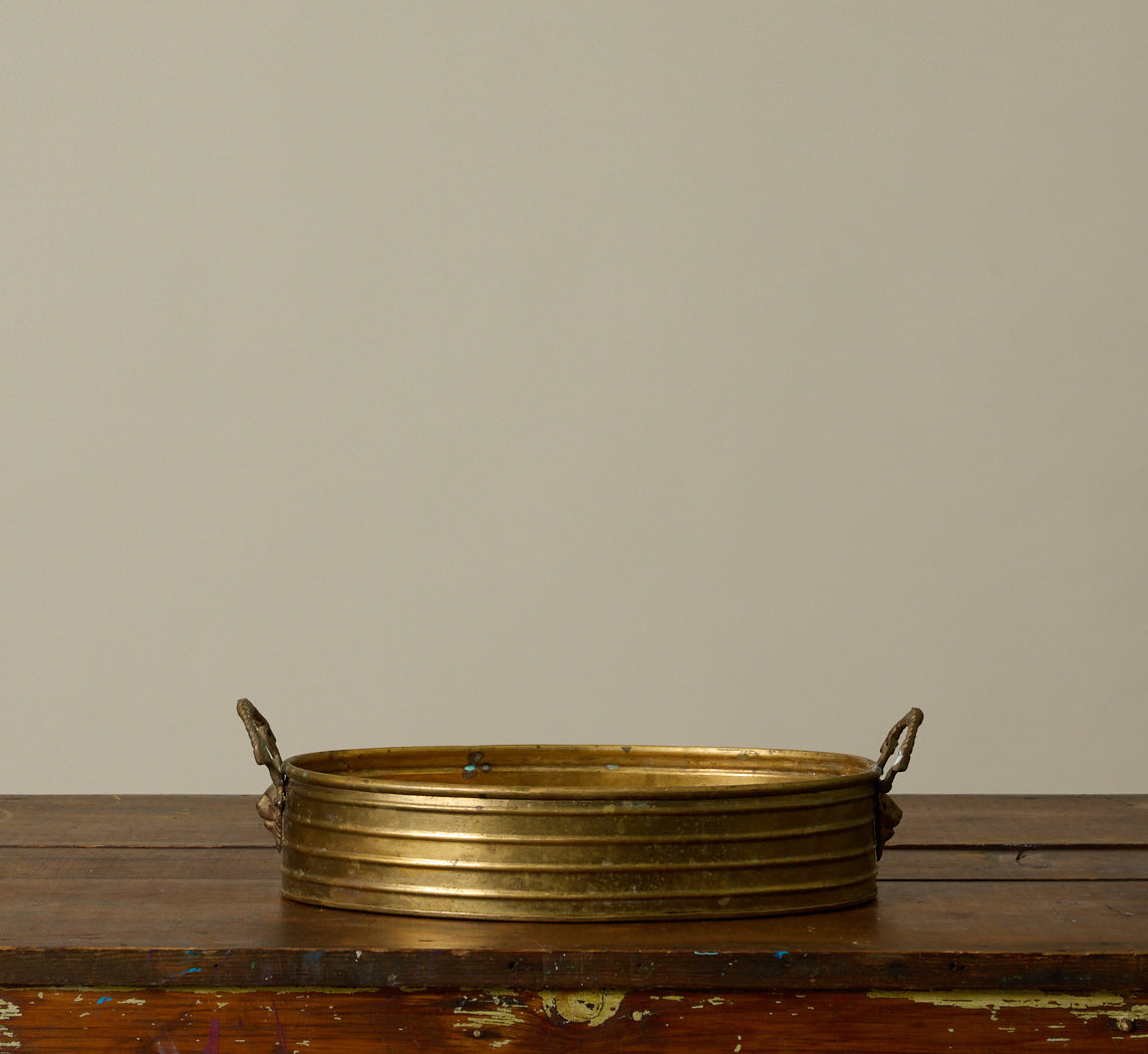 EARLY 20TH CENTURY BRASS JARDINIERE WITH LION'S HEAD HANDLES