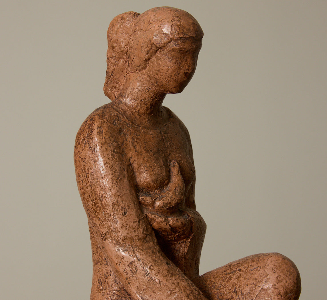 CERAMIC SEATED WOMAN FIGURE