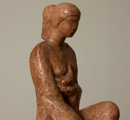 CERAMIC SEATED WOMAN FIGURE