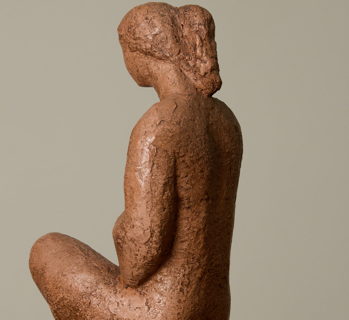 CERAMIC SEATED WOMAN FIGURE