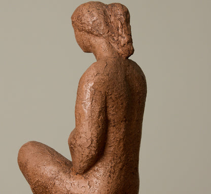 CERAMIC SEATED WOMAN FIGURE
