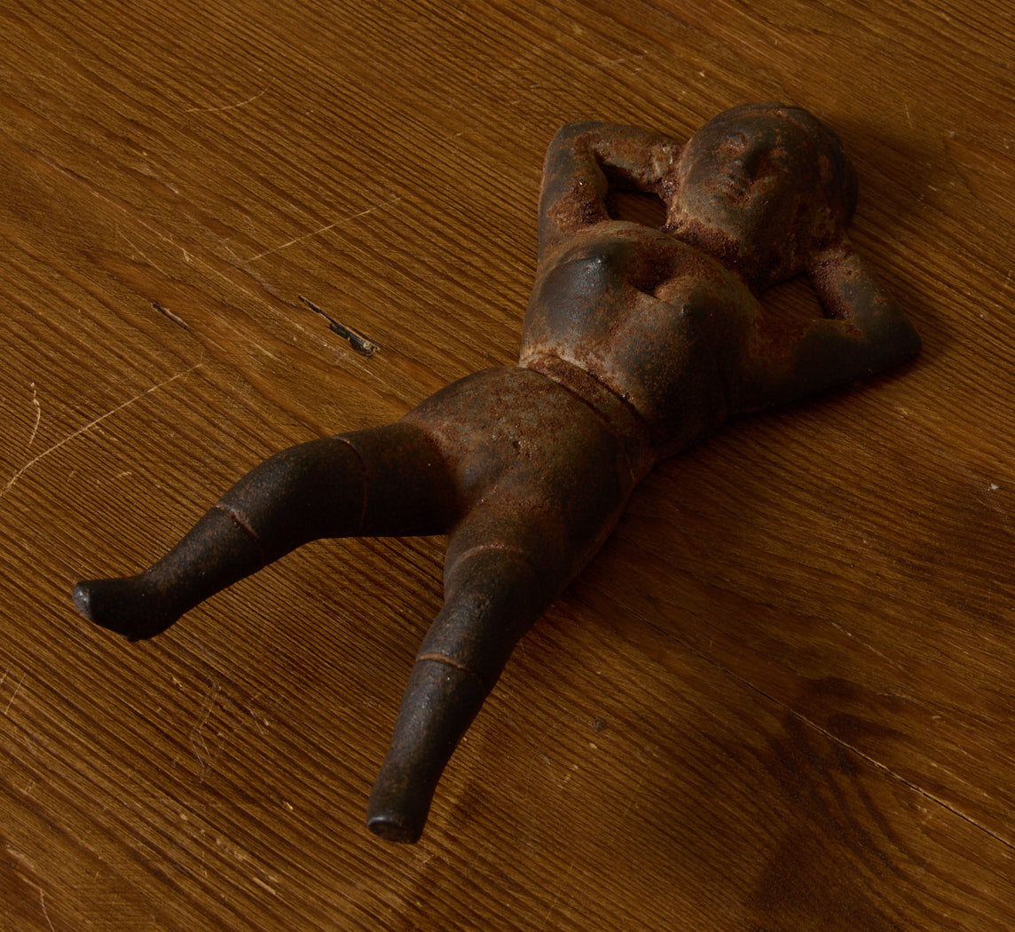 19TH CENTURY CAST IRON "NAUGHTY NELLIE" FIGURINE