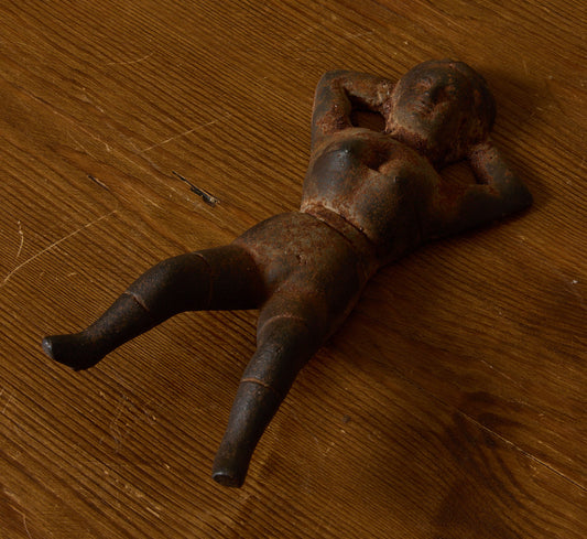 19TH CENTURY CAST IRON "NAUGHTY NELLIE" FIGURINE