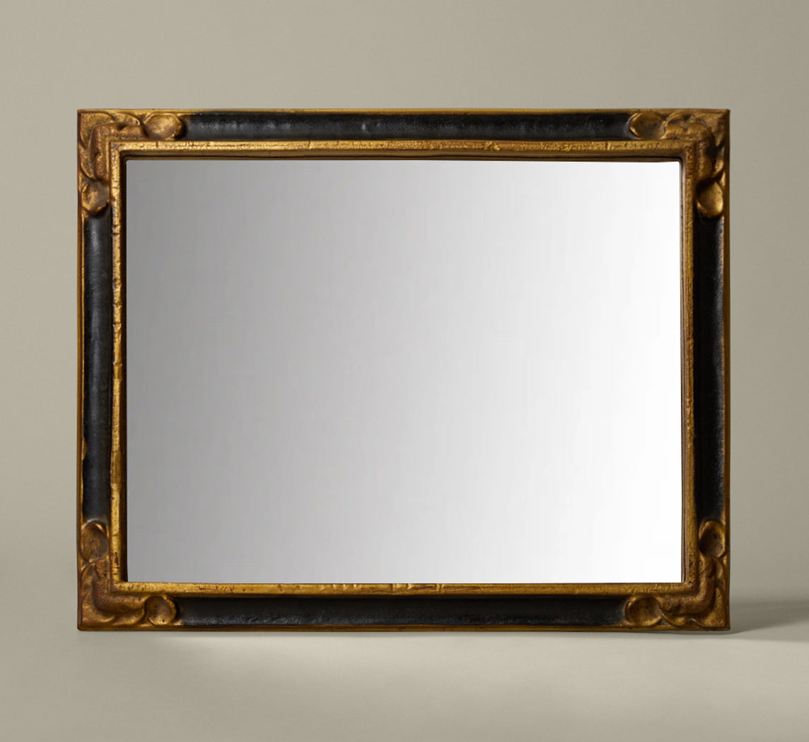 ITALIAN EMPIRE-STYLE EBONY AND GILT MIRROR