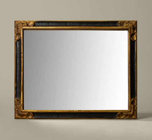 ITALIAN EMPIRE-STYLE EBONY AND GILT MIRROR